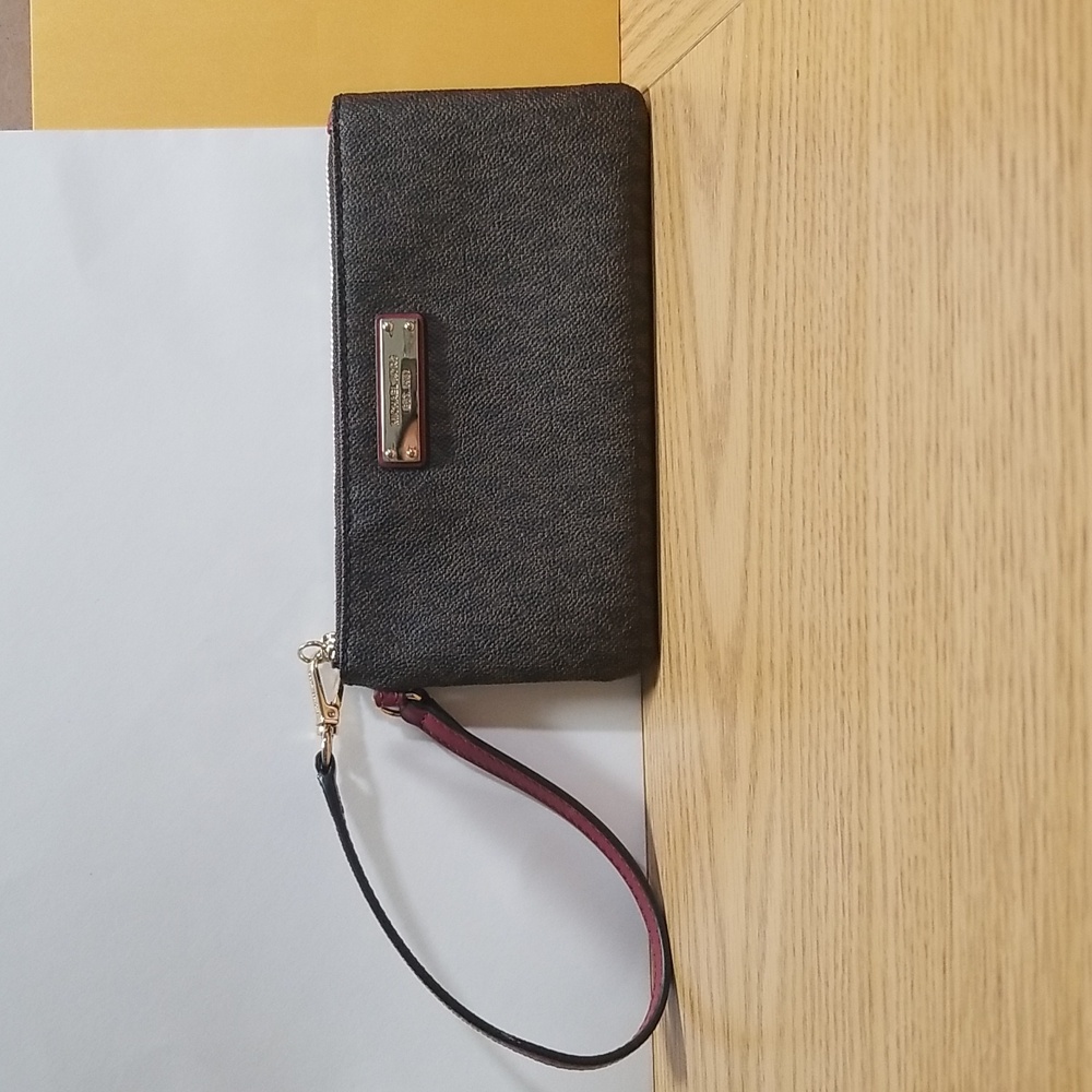 Michael Kors Signature Wristlet In Brown